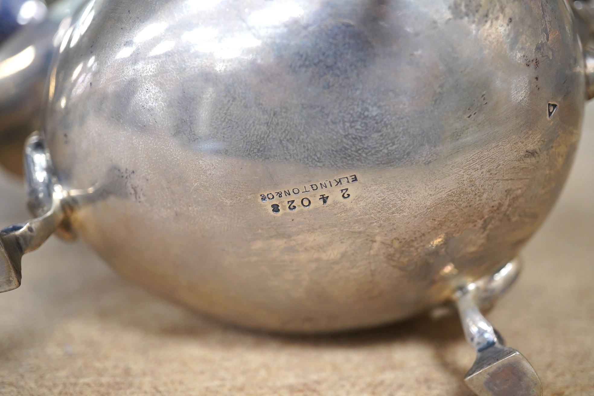 A George II silver sauce boat, London, 1746?, (repair), together with a George V silver sauceboat by Elkington & Co, Birmingham, 1914, 10.5oz. Condition - poor to fair